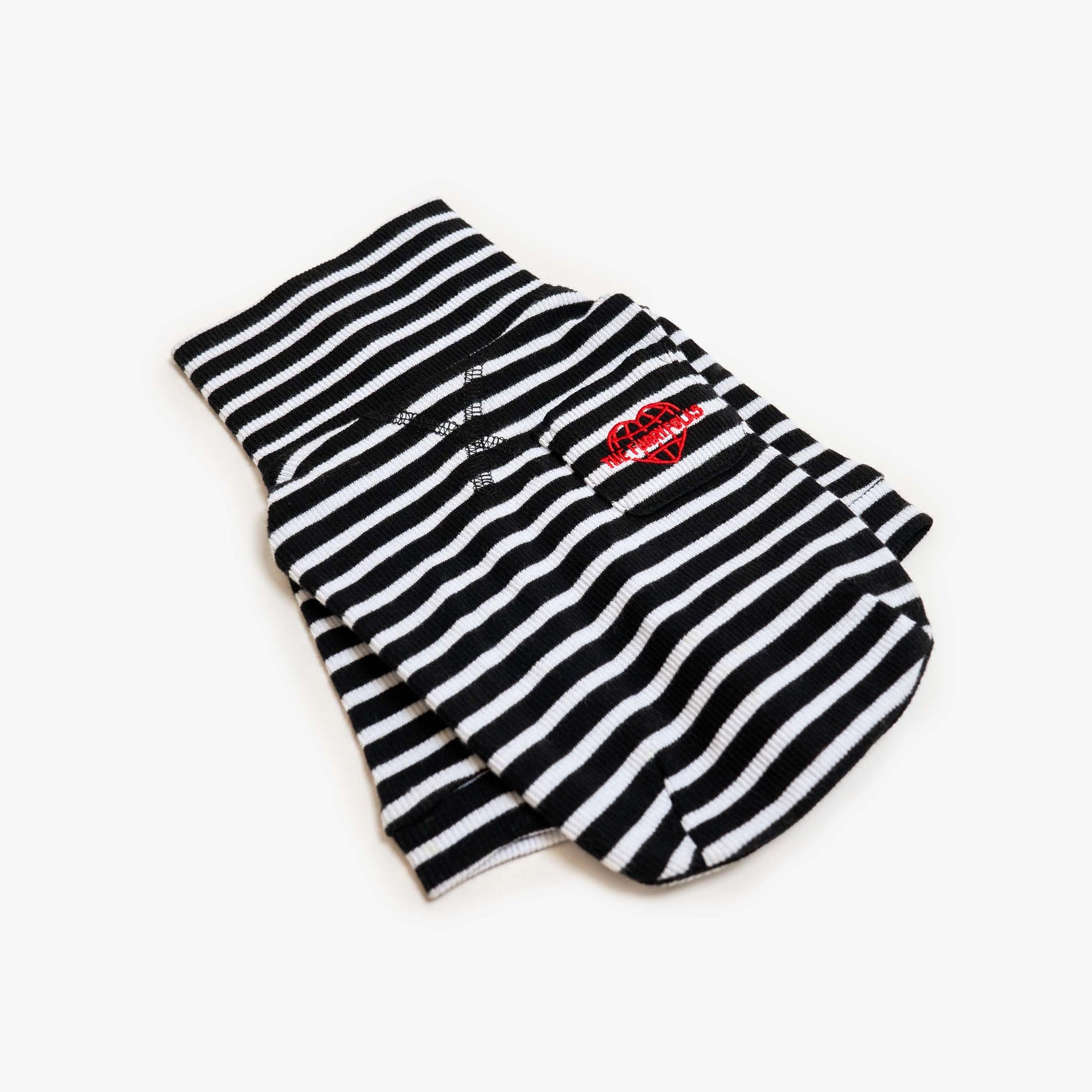 Black and white striped dog shirt with the furryfolks a heart logo, offering a chic and comfortable fit for your pet.
