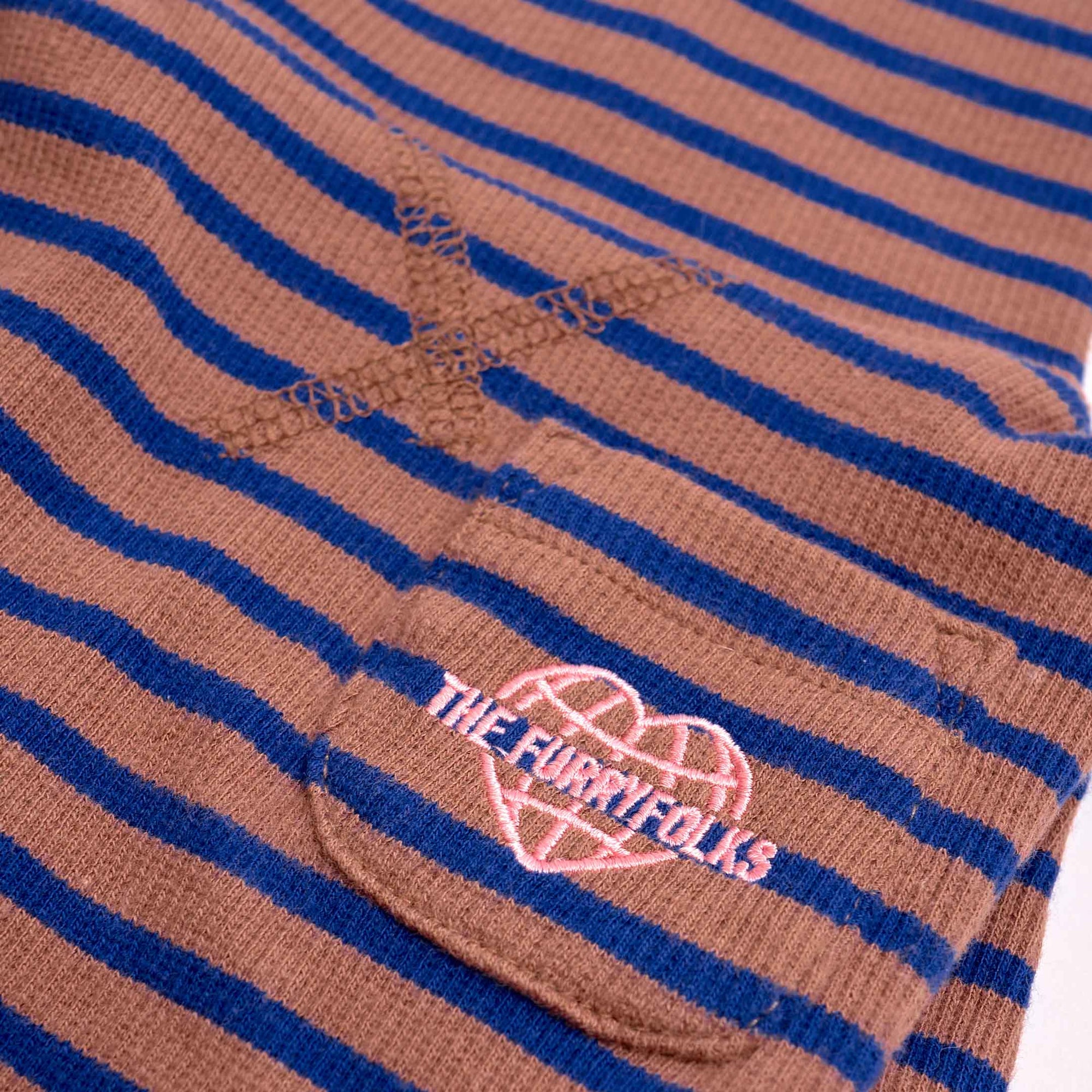 Detail of a Cobalt & Brown striped dog shirt featuring 'THE FURRYFOLKS' logo, embodying pet-friendly fashion.