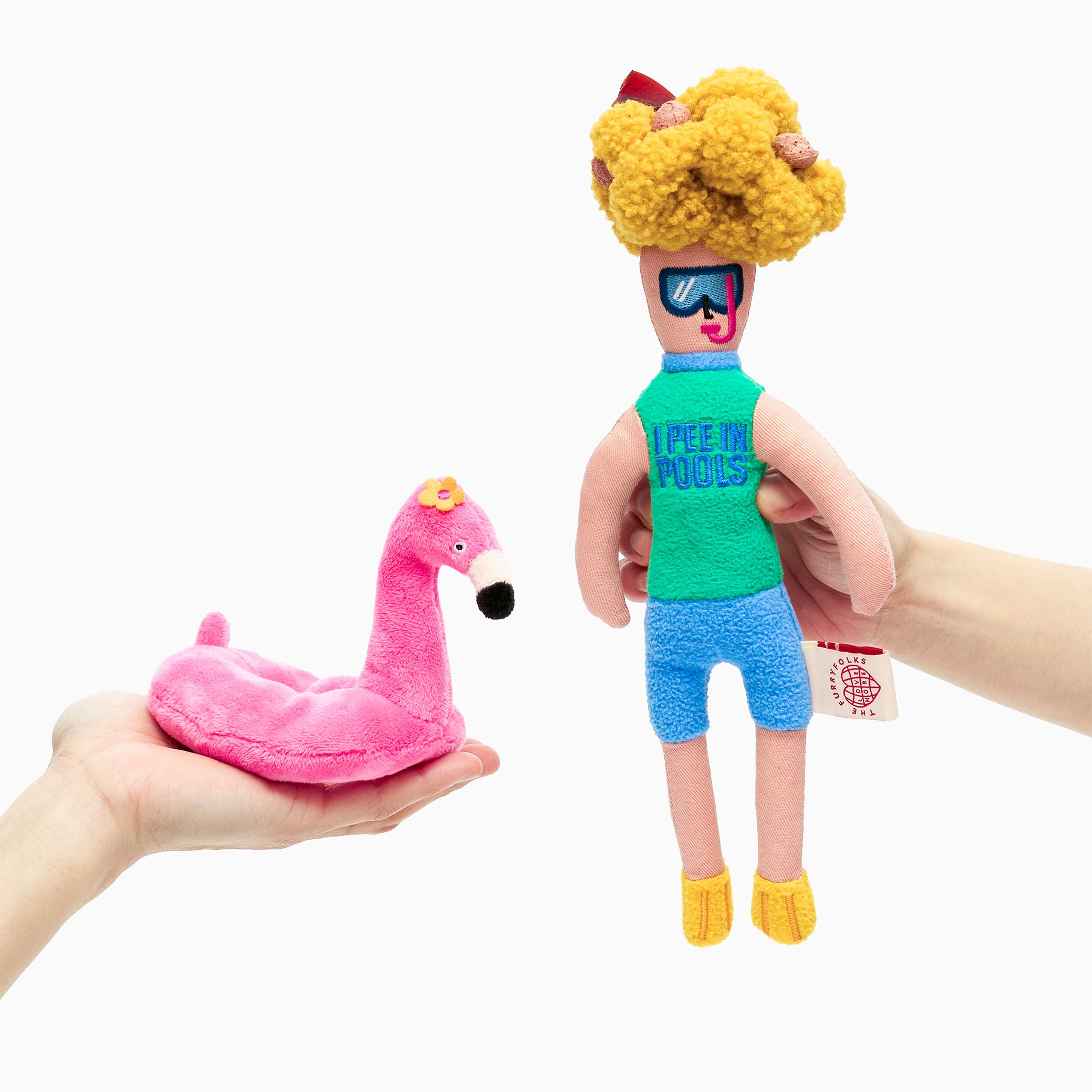 A split view of a plush toy set showing a beach-themed human character and a detachable pink flamingo float, both held by hands against a white background.