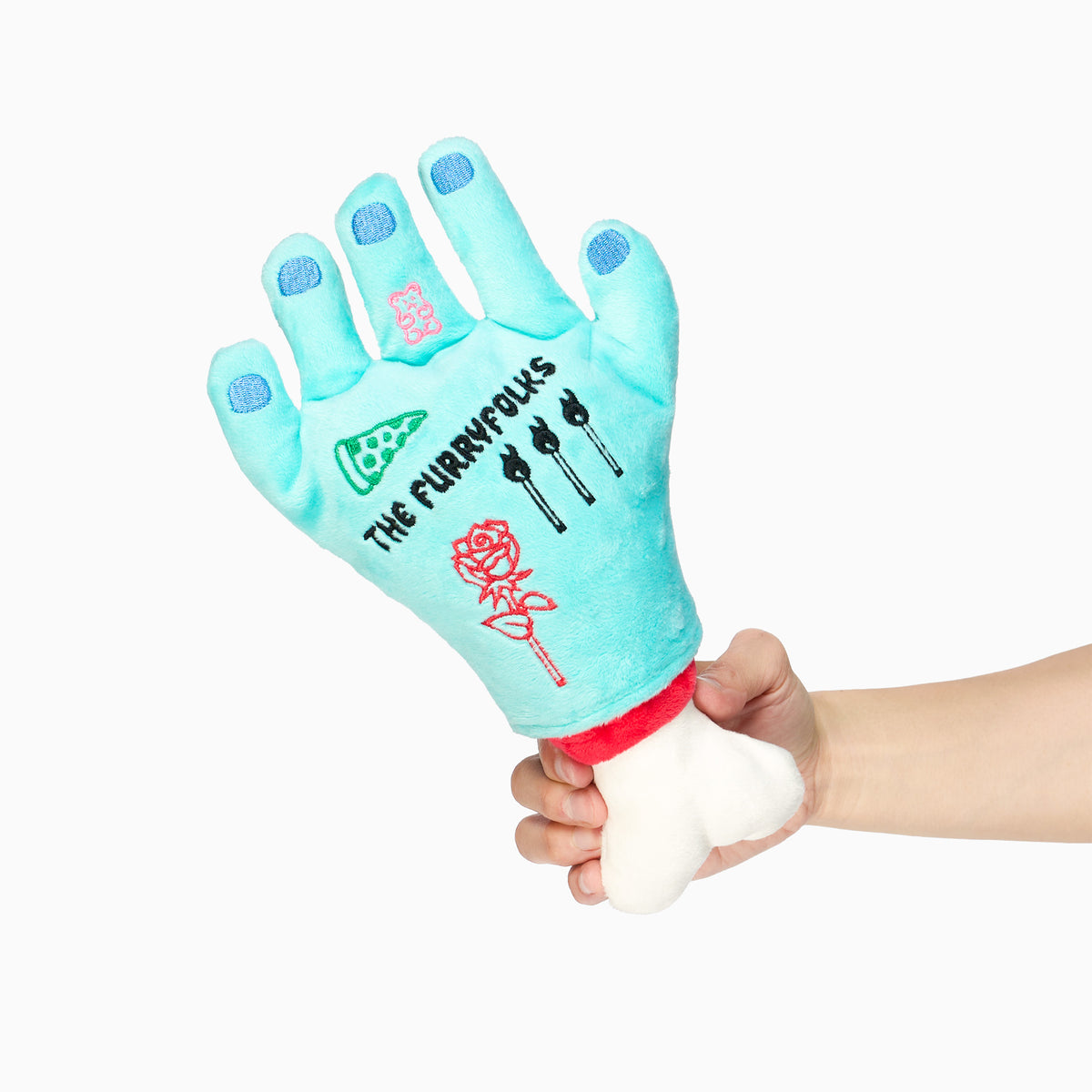 The furryfolks Lost Hand Nosework Dog Toy with turquoise fingers, embroidered tattoos, and a removable white bone.