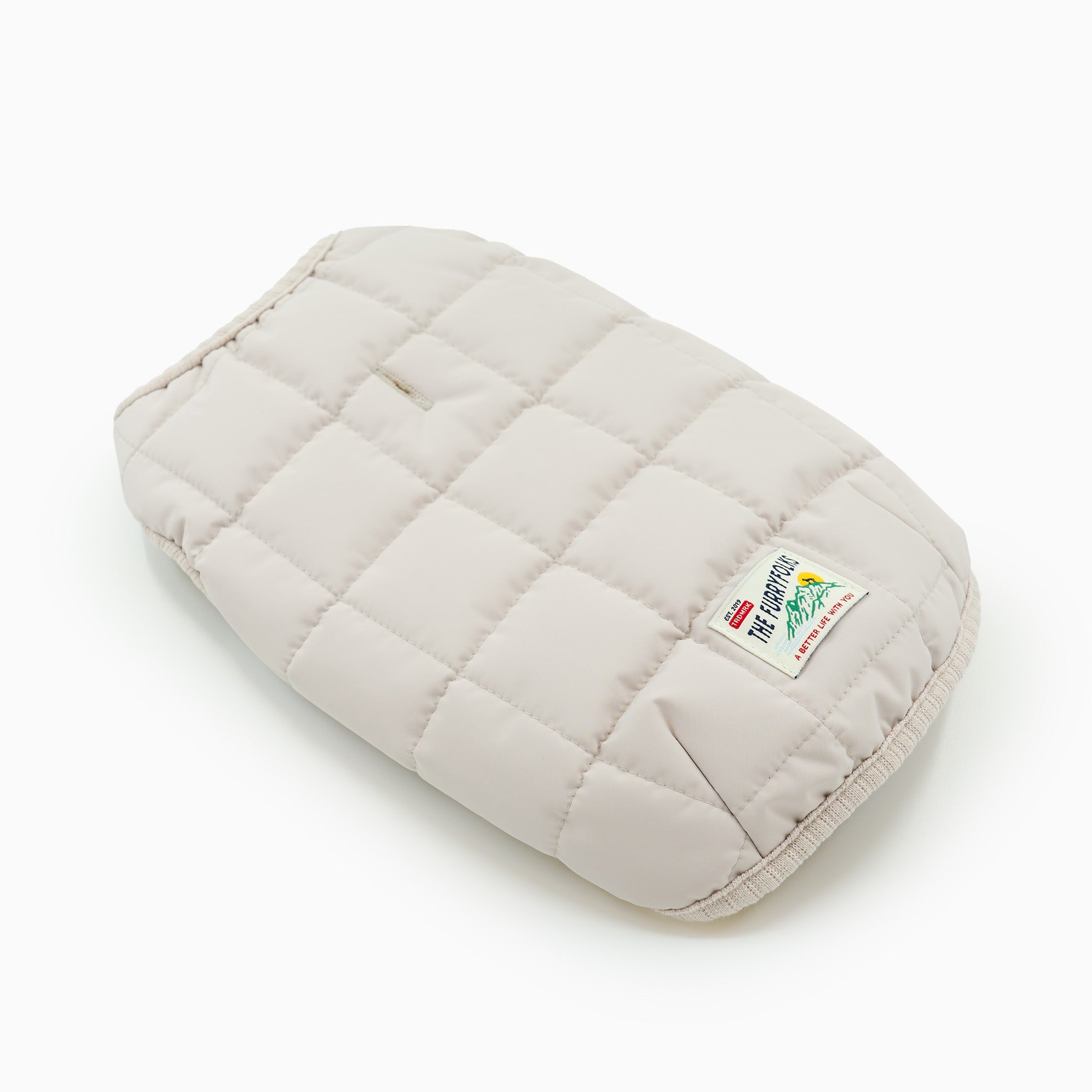 Quilted beige mouse pad with a brand logo on a white background