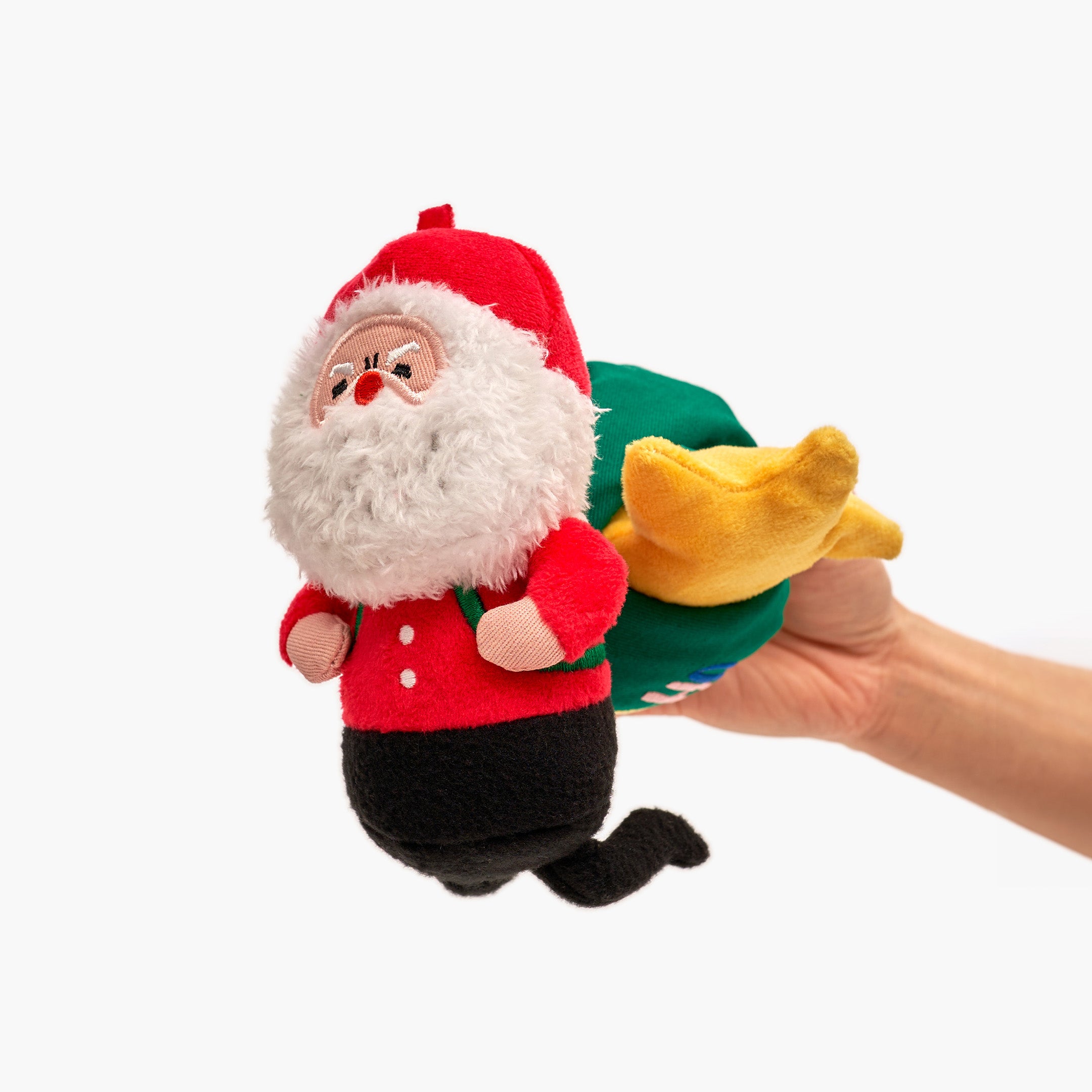 A colorful and interactive holiday toy for dogs, featuring Santa Paws and festive decorations.