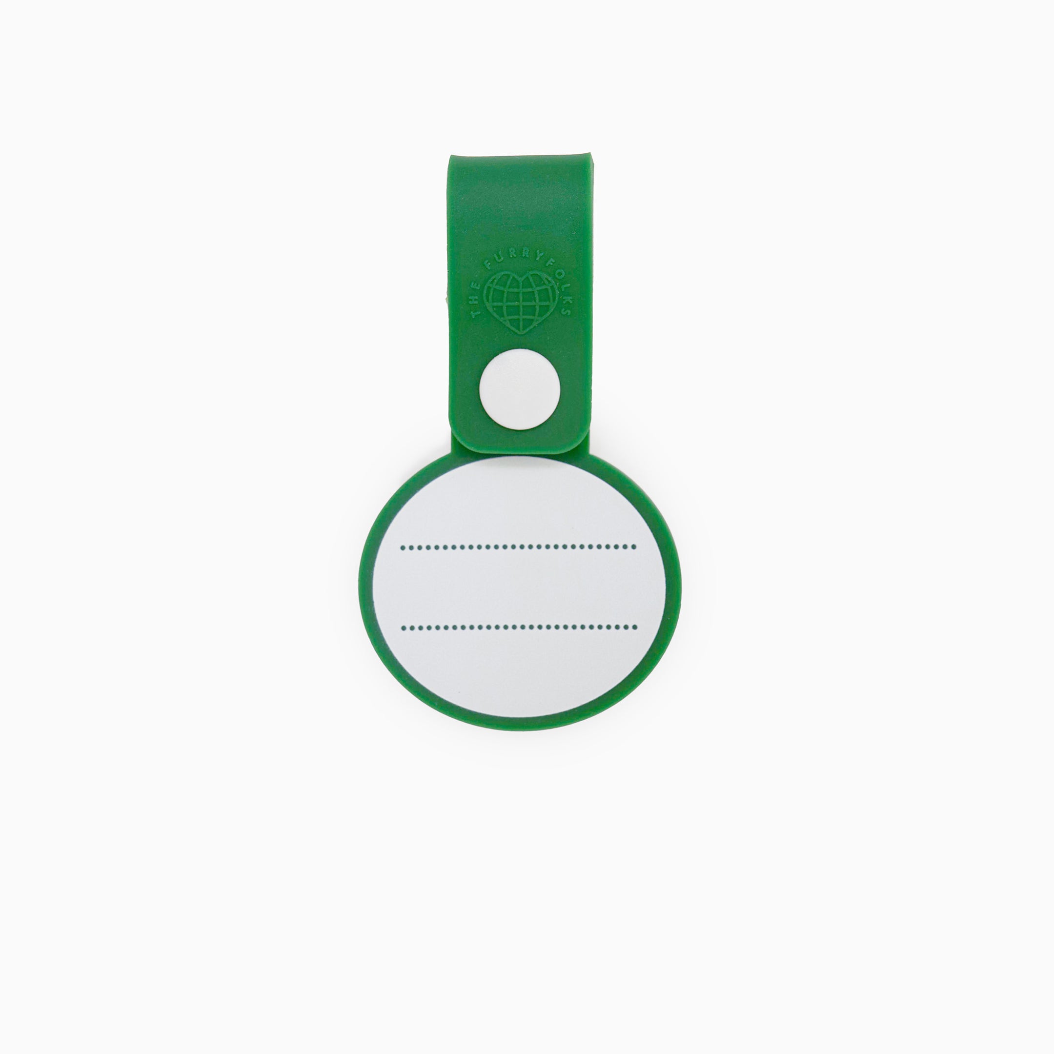 Back view of a dog tag with a green strap and a white button. The tag features a blank white space with dotted lines for writing a pet’s name and contact details. This practical and customizable tag is part of The Furryfolks’ Daily Clip product line, made from 100% non-toxic rubber and designed to be securely attached to a dog leash or collar.