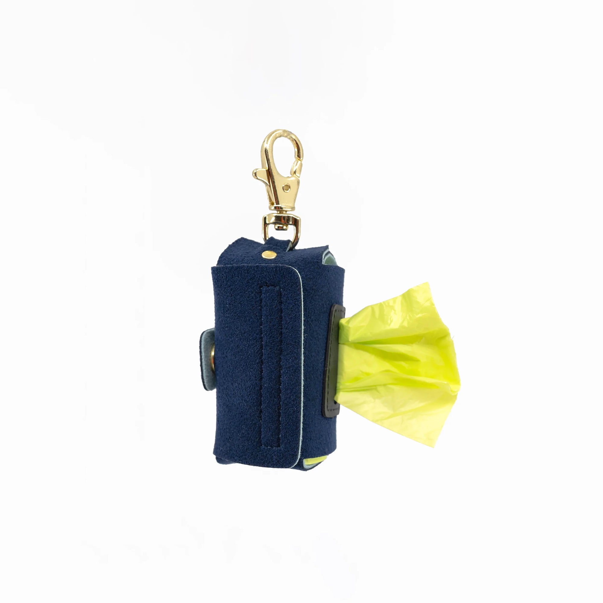 Featured is a navy blue dog poop bag holder with a yellow bag peeking out, complete with a gold clip for easy attachment. The item is part of "the furryfolks" product line, designed for practical pet care use.